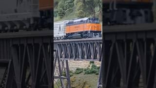 The Milwaukee Road Pink train special crosses the iron bridge #model #railway #milwaukee #pink #dcc