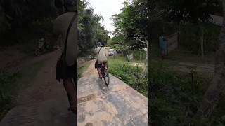 Cycling over the village iron bridge #villagelife #ironbridge #northeastindia #shorts #ytshort