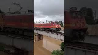 Indian train passing iron bridge