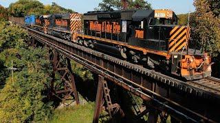 W&LE 7011 rock train over iron bridge in Akron Ohio