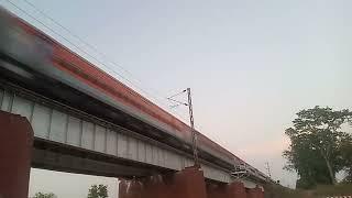 ????High speed crossing Red lhb train on oldest iron bridge