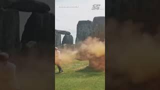 Climate Protesters Spray Orange Powder Over Stonehenge