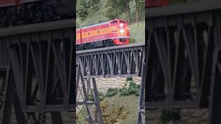 Southern Pacific daylight crosses the iron bridge. #modelrailroad #train #bridge #up #orange #red