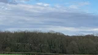 Class 377 5 car passing the iron bridge on Tilehurst Lane. With a Plane.