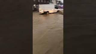 Cars and vans push through flood water in Much Wenlock as Storm Babet takes a toll on Shropshire