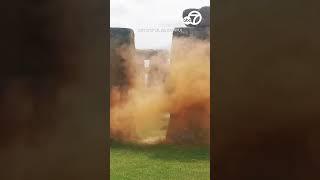 Climate activists spray Stonehenge with orange powder