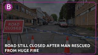 Birmingham road closed after man rescued from huge blaze