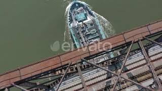 Bulk Carrier Cargo Ship Passing Under An Old Iron Bridge | Stock Footage - Envato elements