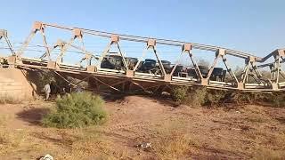 The heavy load of the trailer caused the iron bridge to break. Iran