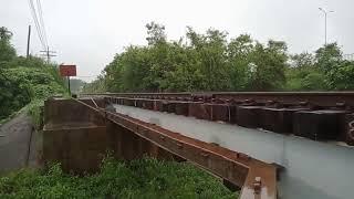 The train runs over the iron bridge